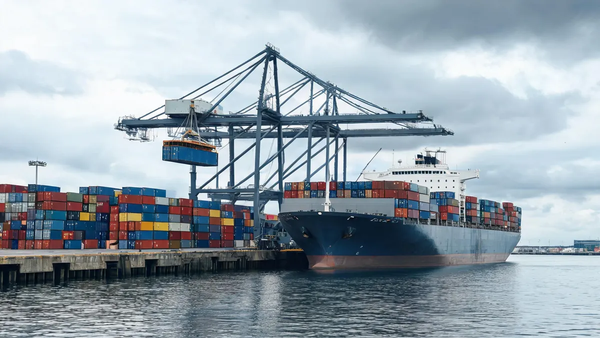 Cargo ship and stacked shipping containers at a port