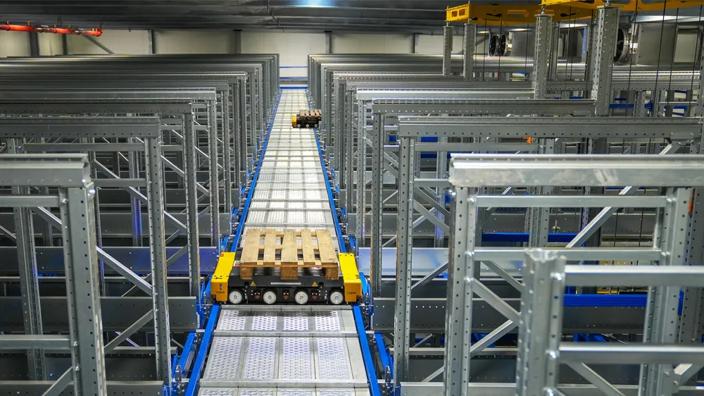 Worker organizing combined parcels in a China warehouse for consolidation shipping