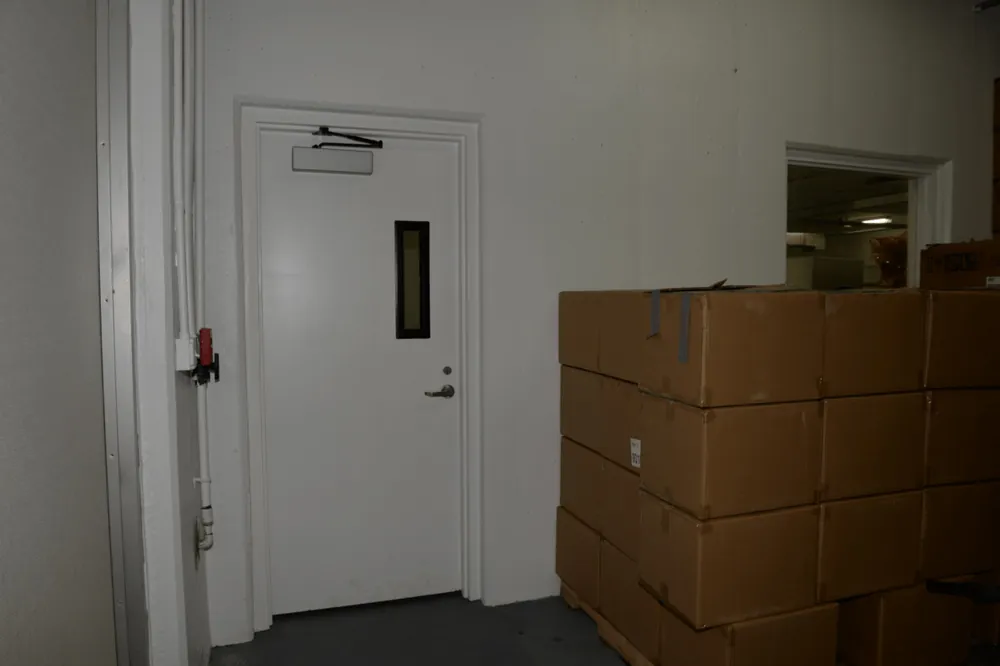 Cardboard boxes stacked on a pallet in a warehouse
